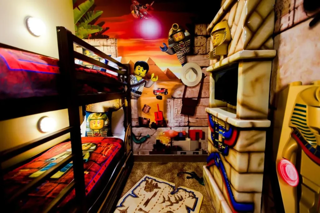 Adventure-themed kids sleeping area with bunk bed and LEGO decor at LEGOLAND Hotel in Winter Haven
