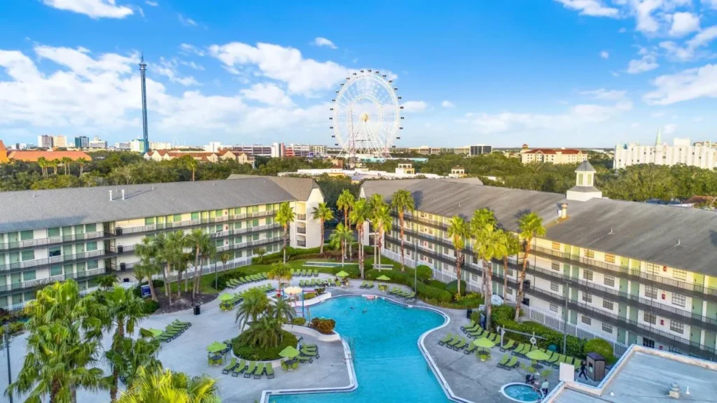 Aerial view of Avanti International Resort pool and wings, The Orlando Eye at ICON Park behind