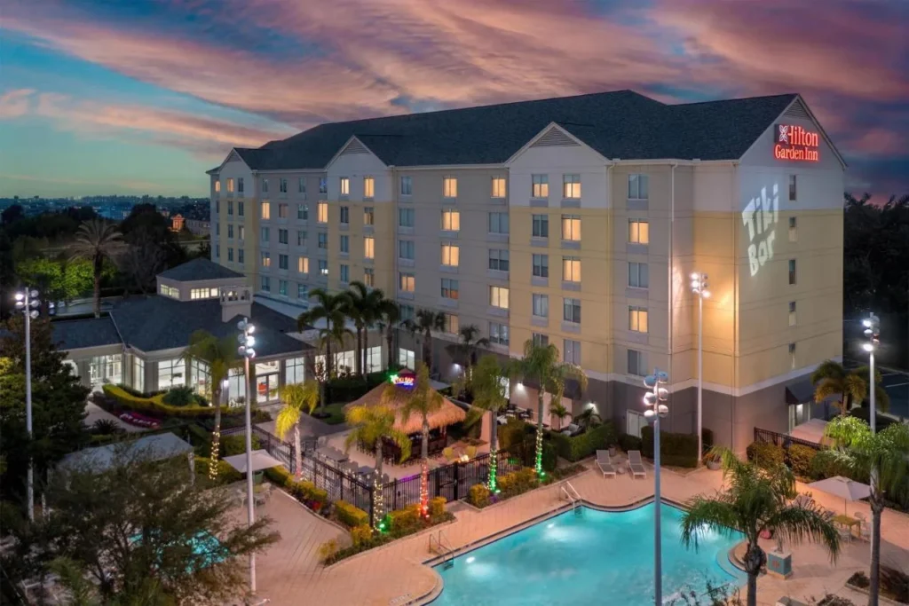 Aerial view of Hilton Garden Inn Orlando International Drive North with its pool at dusk