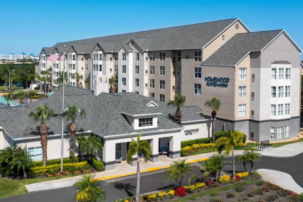 Aerial view of Homewood Suites by Hilton Orlando-Nearest to Universal Studios with palms and entrance