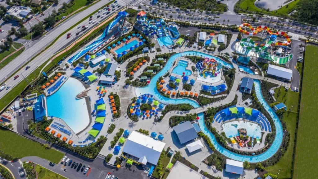Aerial view of Island H2O's wave pool, lazy river and slides, next to Margaritaville Resort Orlando