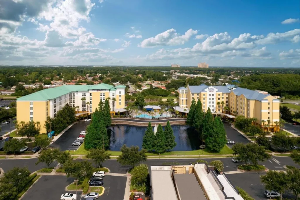 Aerial view of SpringHill Suites Orlando at SeaWorld, left, with the pool, pond and Fairfield Inn
