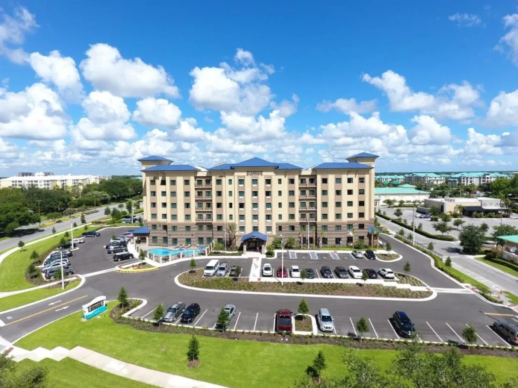 Aerial view of Staybridge Suites Orlando at SeaWorld with its pool and parking lot