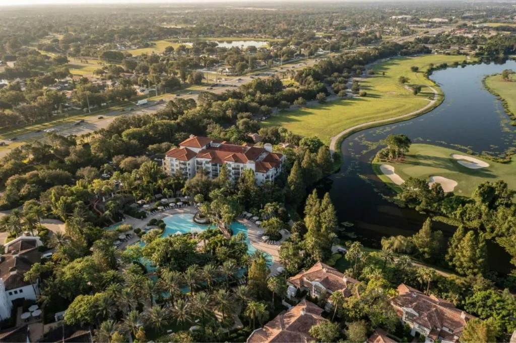 Aerial view of the pool complex, villa buildings and golf course at Marriott's Lakeshore Reserve
