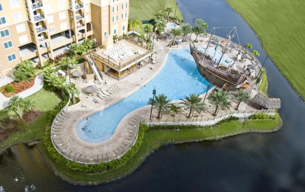 Aerial view of the seahorse-shaped pool and bar deck at Lake Buena Vista Resort Village