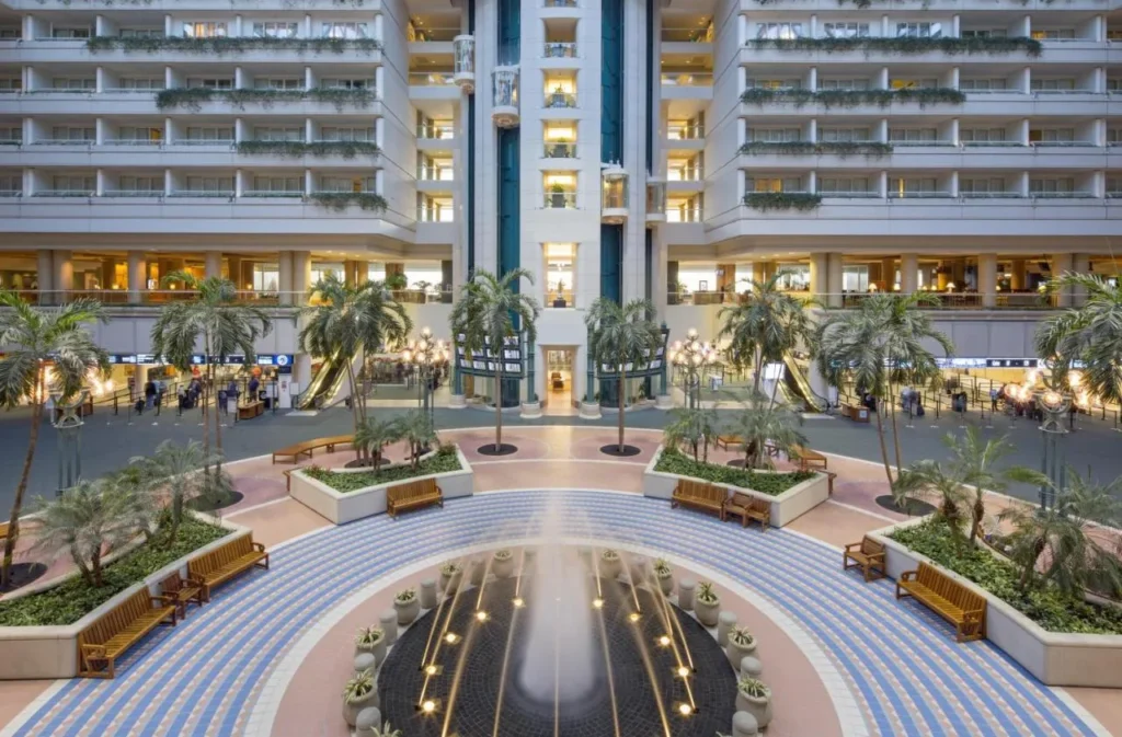 Airport atrium fountain and palm trees below the Hyatt Regency Orlando International Airport room floors