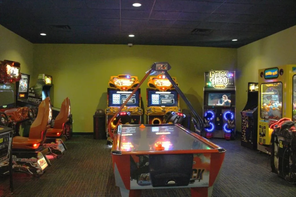 Arcade room with racing games and air hockey at Rosen Inn International