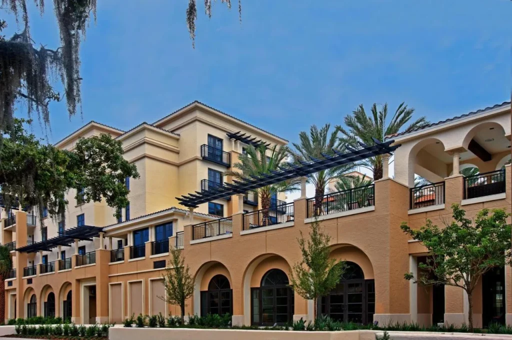 Arched facade and balconies of The Alfond Inn under Spanish moss, Winter Park