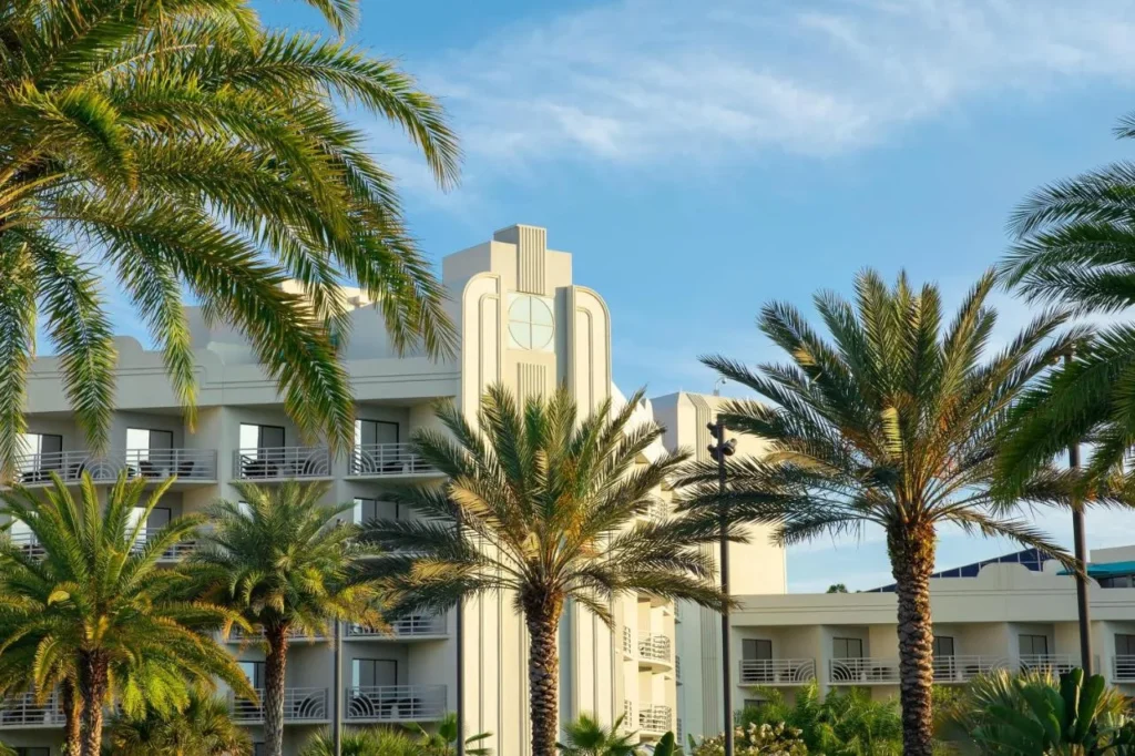 Art deco tower and balconies behind palm trees at Hilton Orlando Buena Vista Palace