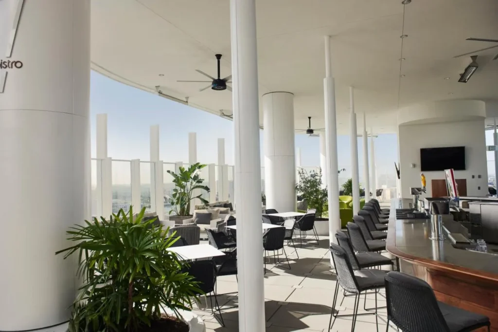 Bar 17 Bistro rooftop terrace with tables, bar stools and open-air views at Universal Aventura Hotel