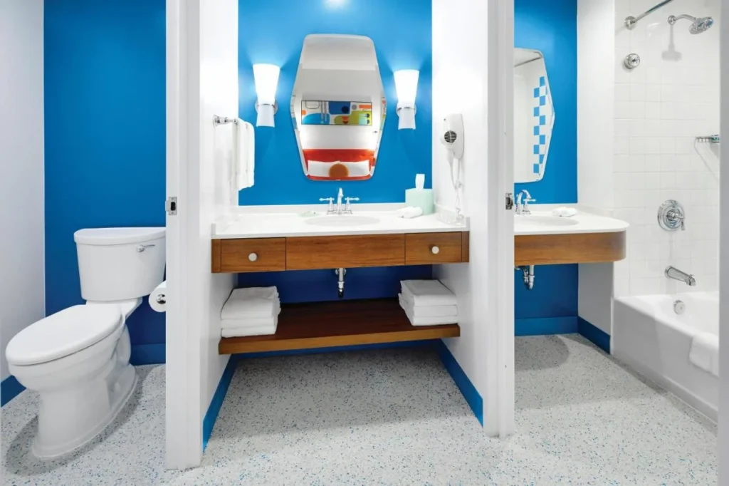 Bathroom split into separate toilet, vanity and tub sections at Universal Cabana Bay Beach Resort