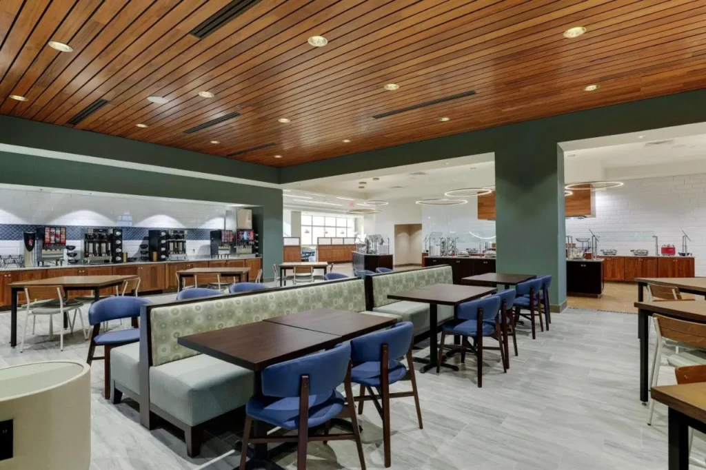 Breakfast area with booths, coffee station and buffet counters at Drury Plaza Hotel Orlando