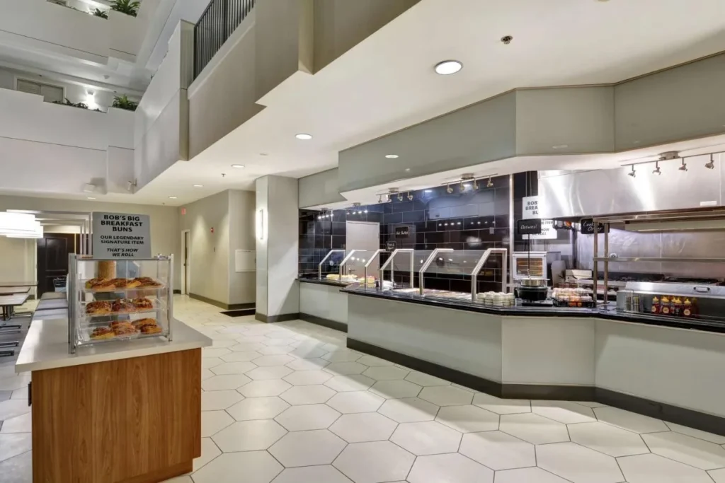 Breakfast area with pastry stand and buffet counter at Embassy Suites Orlando Downtown