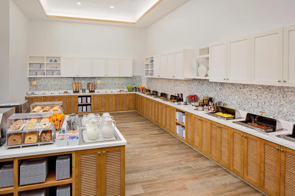 Breakfast buffet with breads, milk jugs and chafing dishes at Hyatt House across from Universal