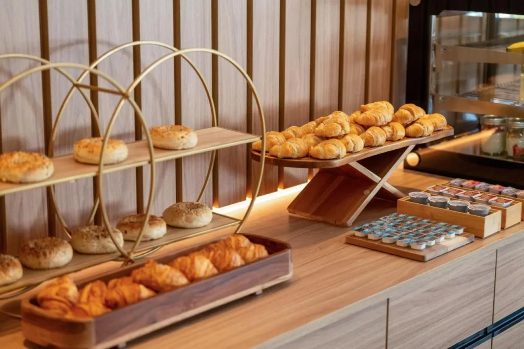 Breakfast counter with bagels, croissants and jams at Melia Orlando Celebration