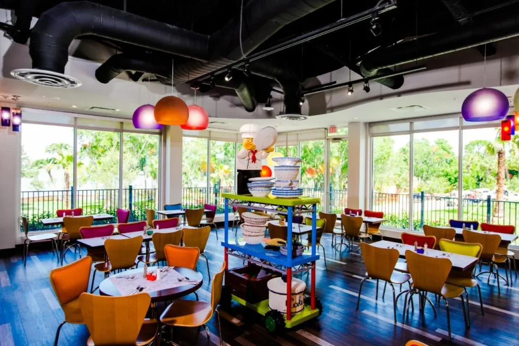Bricks Family Restaurant dining room with large windows and a LEGO chef at the LEGOLAND Hotel