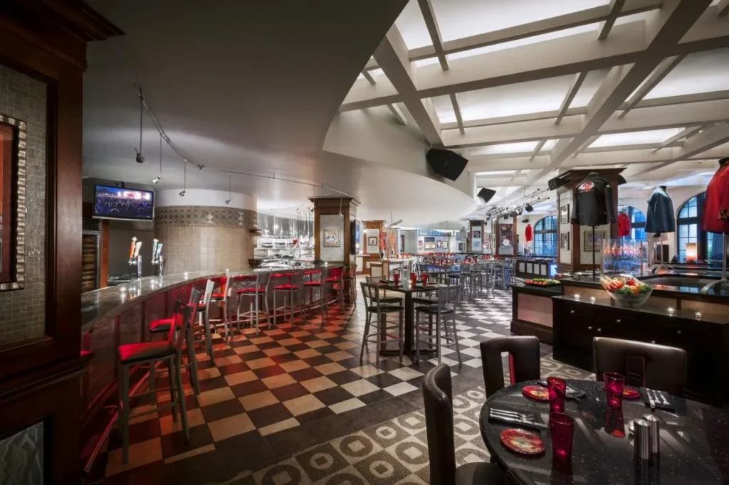 Casual restaurant with checkered floor, red bar stools and rock memorabilia at Hard Rock Hotel Orlando