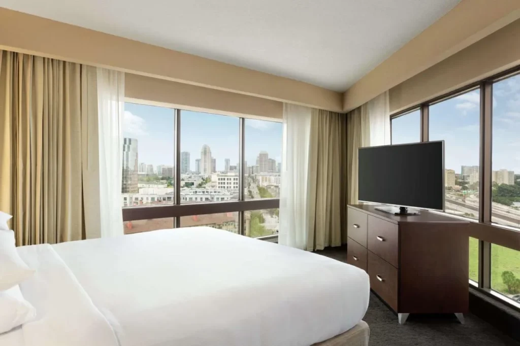 Corner guest room at DoubleTree by Hilton Orlando Downtown with wide downtown skyline views