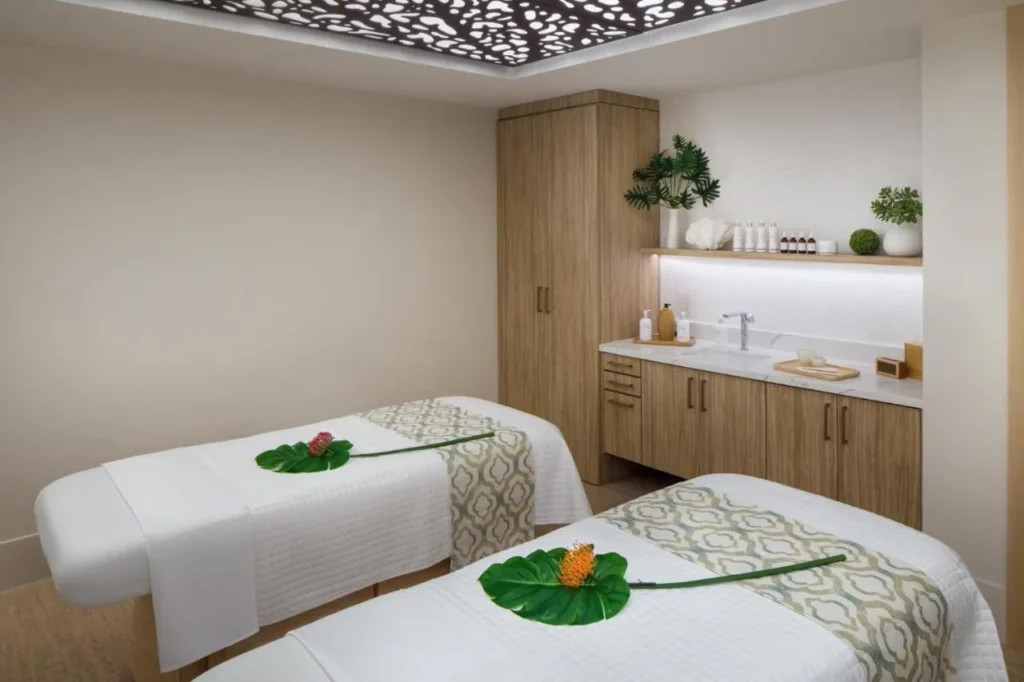 Couples treatment room with two massage tables at The Spa at The Alfond Inn