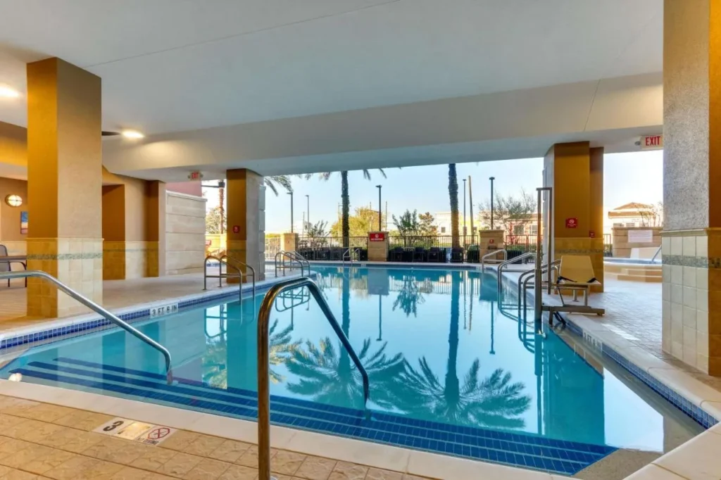 Covered section of the outdoor pool with a lift at Drury Inn & Suites near Universal