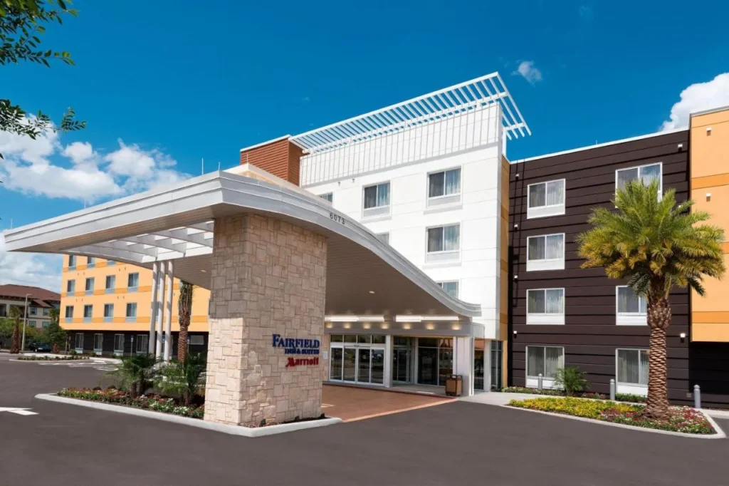 Curved entrance canopy and stone pillar at Fairfield Inn & Suites Orlando Kissimmee/Celebration