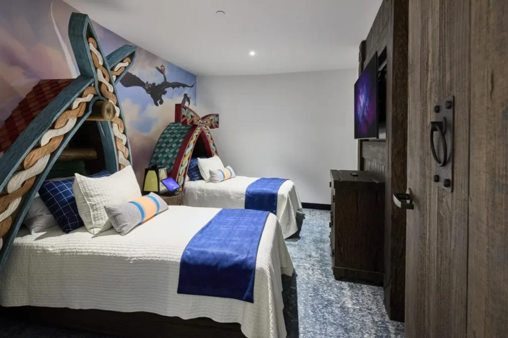 Dragon-themed kids' room with two Viking-style twin beds at Universal Helios Grand Hotel