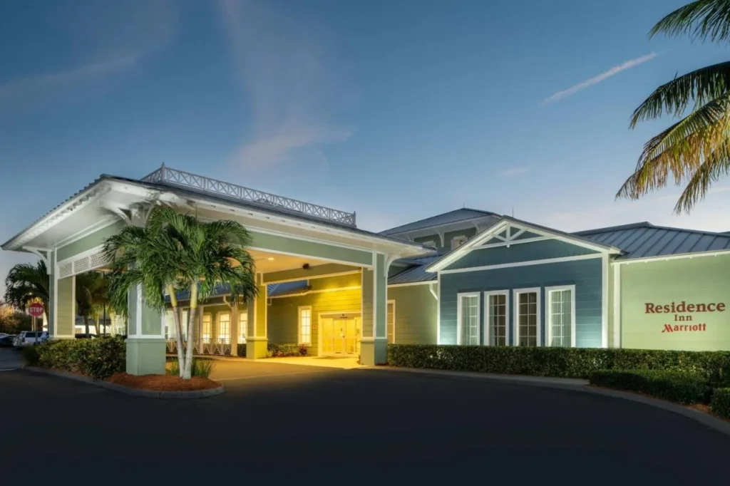 Entrance and porte-cochere of Residence Inn by Marriott Cape Canaveral Cocoa Beach at dusk