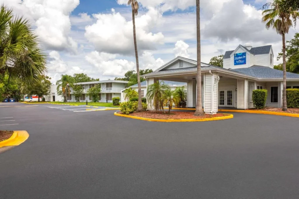 Entrance drive and lobby with Developer Inn Baymont sign at Baymont Lake Buena Vista South