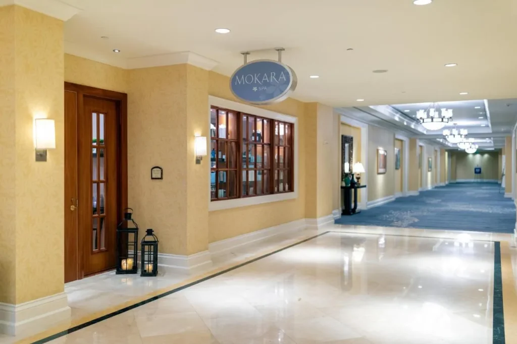 Entrance to Mokara Spa with hanging sign and candle lanterns at Omni Orlando Resort at ChampionsGate