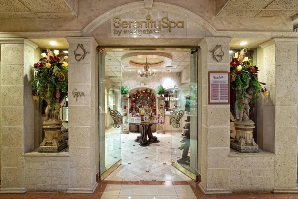 Entrance to Serenity Spa by Westgate with stone columns and a chandelier at Westgate Lakes