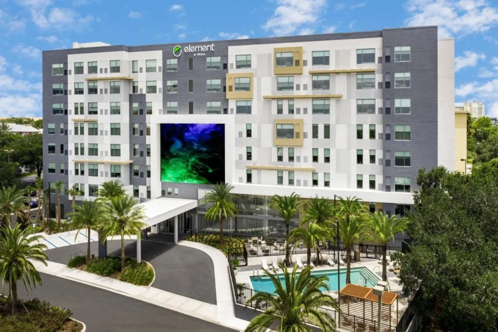 Exterior, entrance drive and pool area of the Element Orlando Universal Blvd. hotel