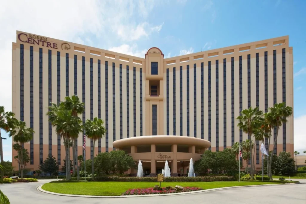 Exterior of Rosen Centre Hotel with entrance fountains, palm trees and a circular drive