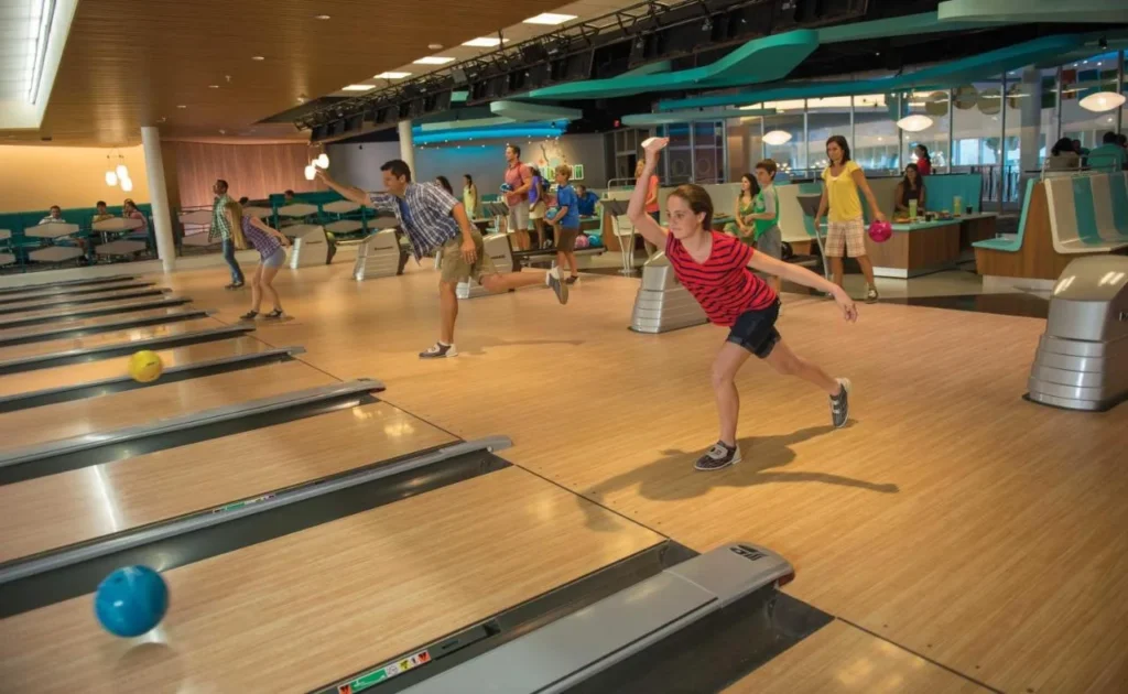 Families bowling on the retro lanes of Galaxy Bowl at Universal Cabana Bay Beach Resort