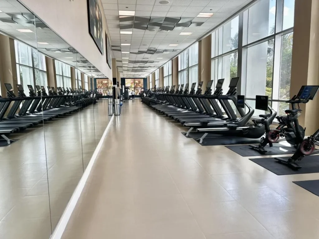 Fitness center with long rows of treadmills and exercise bikes at Hilton Orlando