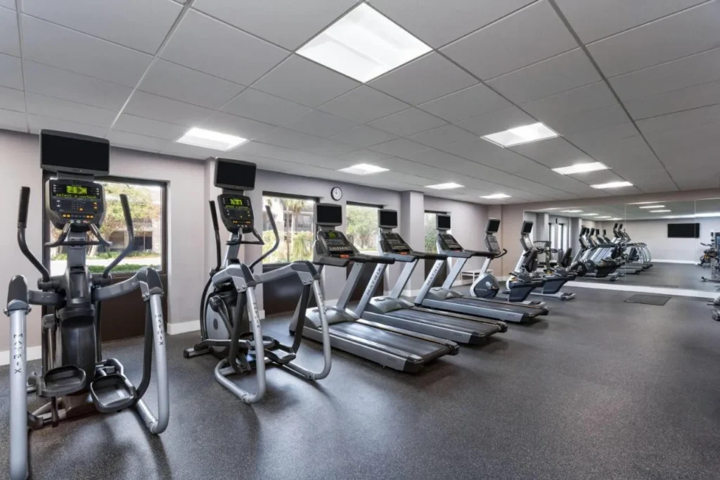 Fitness center with treadmills, ellipticals and a mirrored wall at Wyndham I-Drive Avanti Resort