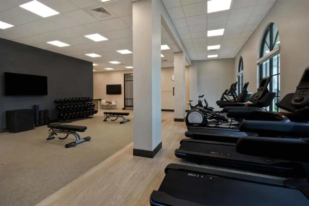 Fitness center with treadmills, ellipticals, benches and dumbbells at Homewood Suites Flamingo Crossings