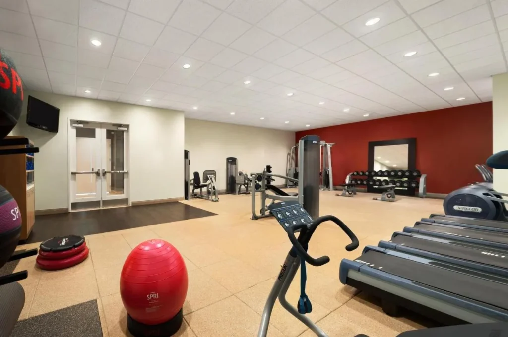 Fitness center with treadmills, weight machines and dumbbells at DoubleTree at the Entrance to Universal