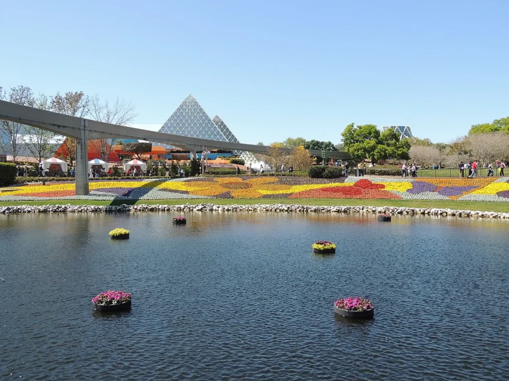 Floating flower planters, the monorail beam and patterned flower beds at EPCOT's Flower & Garden Festival