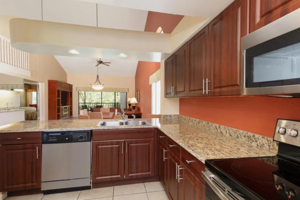 Full villa kitchen with granite counters, dishwasher and stove at Westgate Vacation Villas Resort