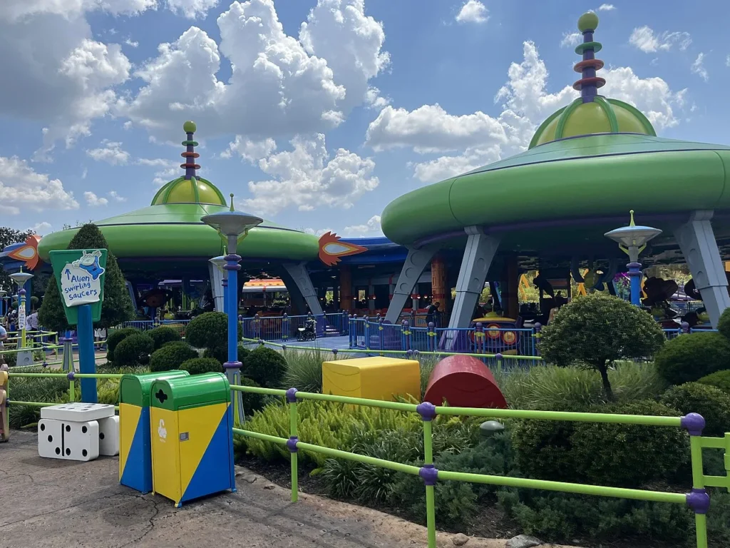 Green flying-saucer canopies and entrance sign of Alien Swirling Saucers in Toy Story Land, Hollywood Studios