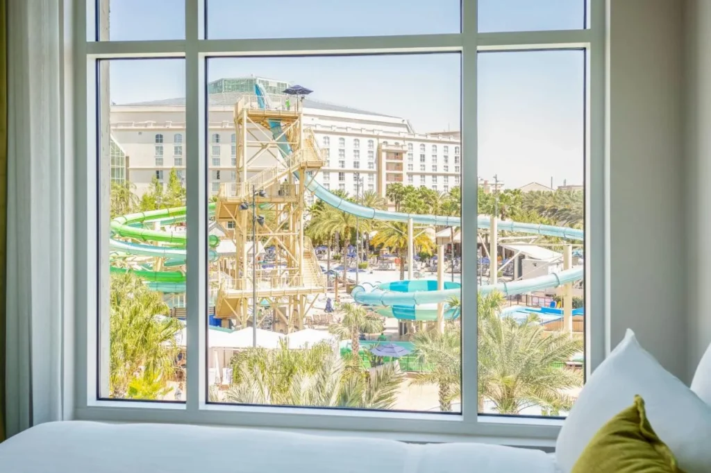 Guest room window at Gaylord Palms overlooking the Cypress Springs Water Park slide tower