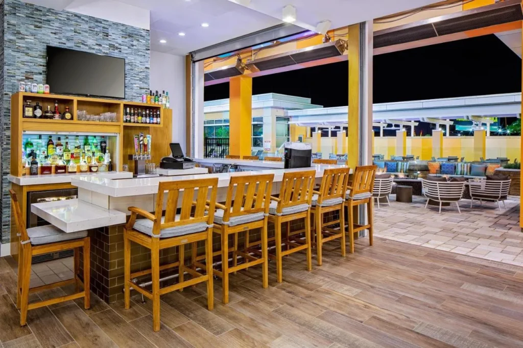 H Bar counter opening onto the patio at Hyatt House across from Universal Orlando