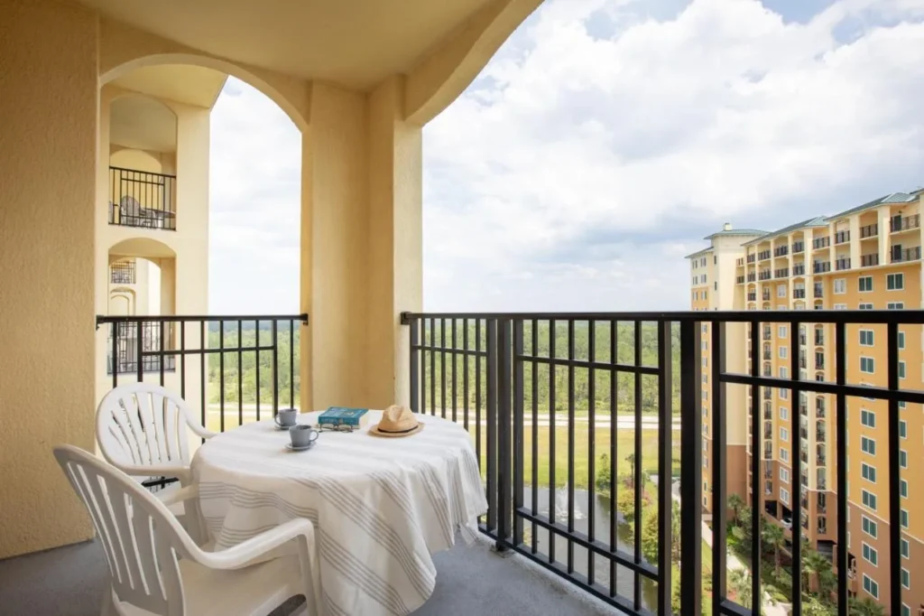 High-floor balcony with a table and two chairs at Lake Buena Vista Resort Village