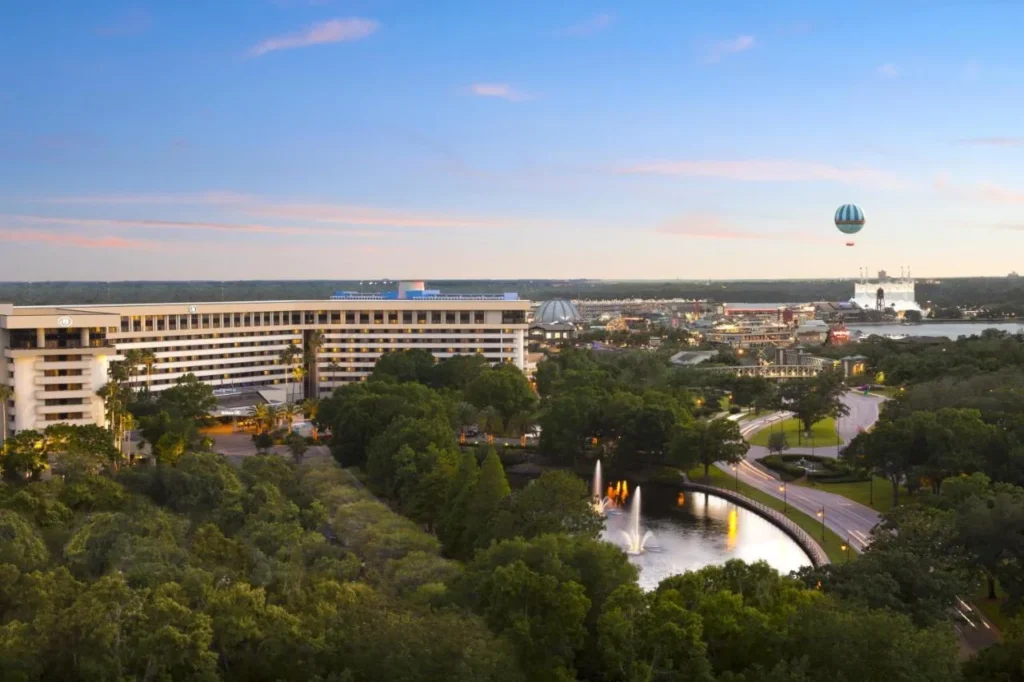 Hilton Orlando Lake Buena Vista at sunset with Disney Springs and its balloon in the distance