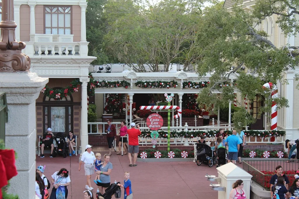 Holiday garlands and giant candy canes at the Candy Cane Garden on Magic Kingdom's Main Street