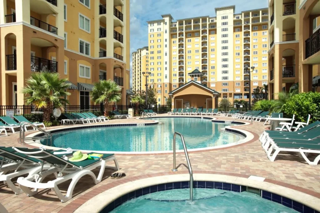 Hot tub and a second pool ringed by loungers at Lake Buena Vista Resort Village