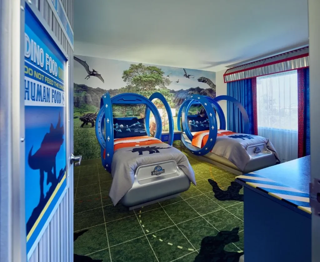 Jurassic World Kids' Suite bedroom with two dinosaur-themed beds and mural, Loews Royal Pacific Resort
