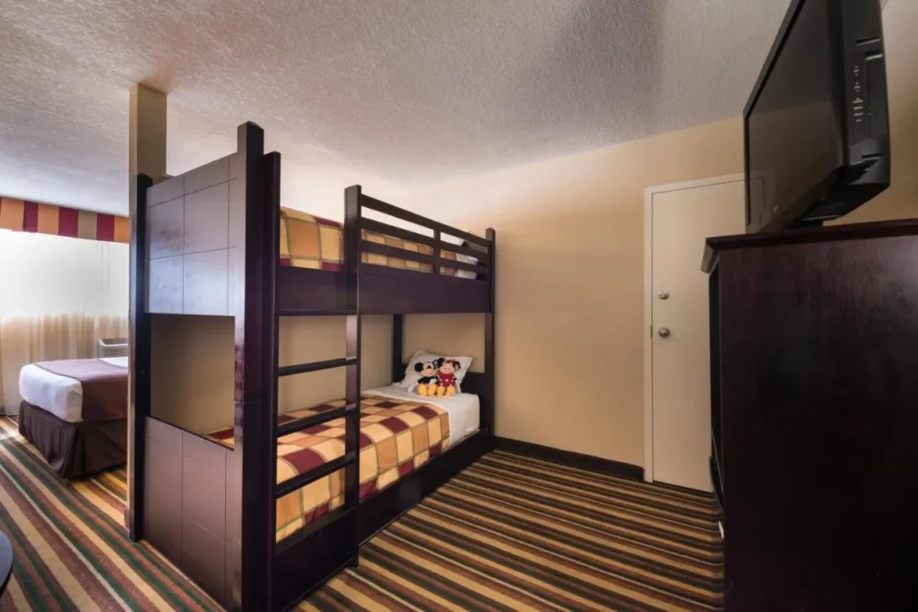 Kids Room with a bunk bed beside a queen bed, Holiday Inn and Suites Orlando SW