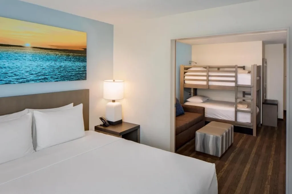 King bed and bunk-bed nook in a family suite at Hyatt House across from Universal