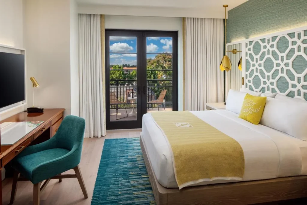 King guest room at The Alfond Inn with French doors opening onto a small balcony
